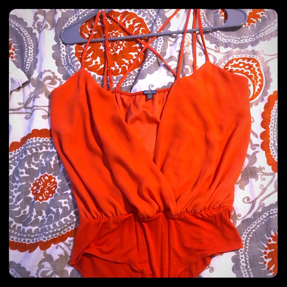 low cut orange onesie.